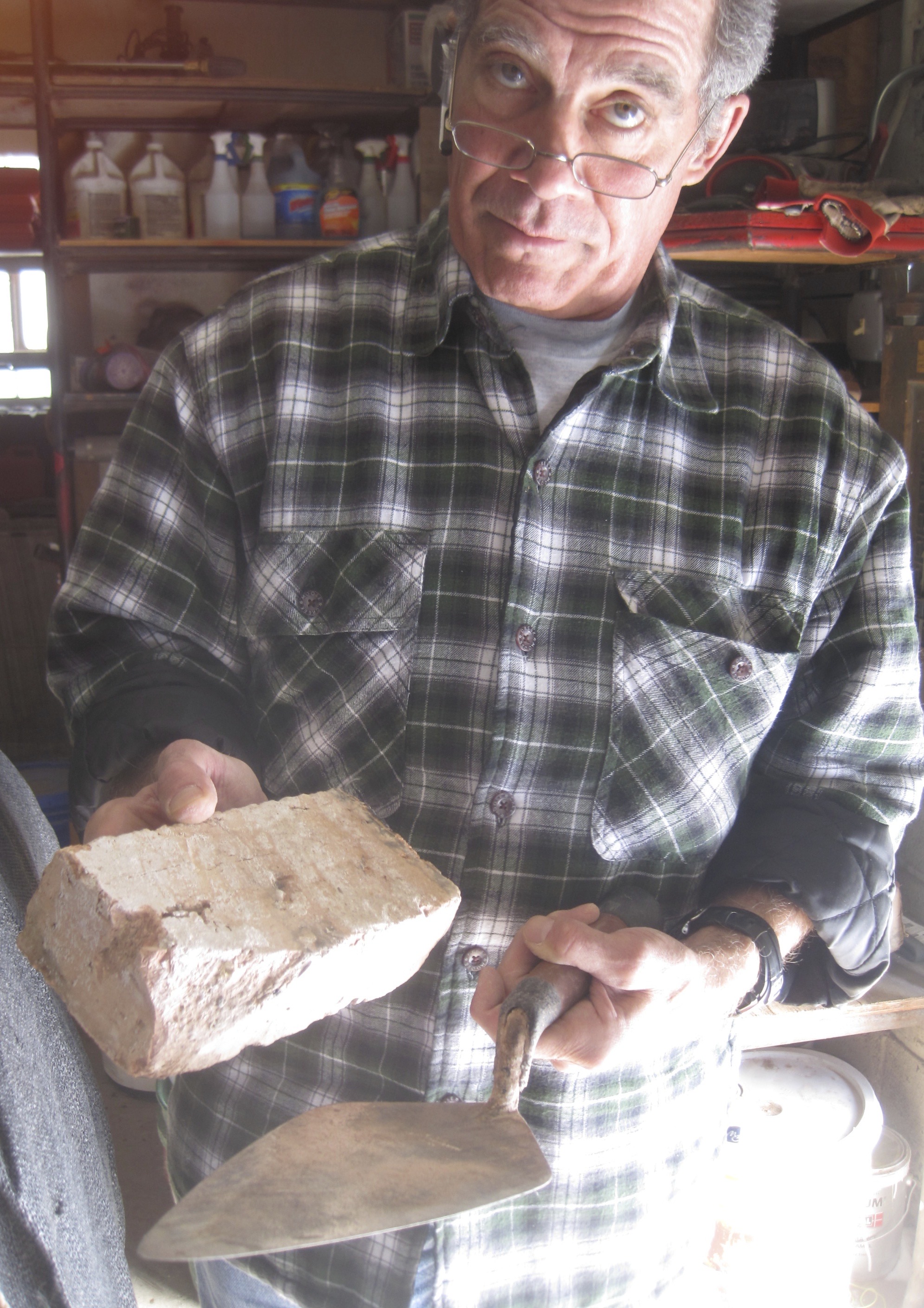 Howard Reese with brick and trowel